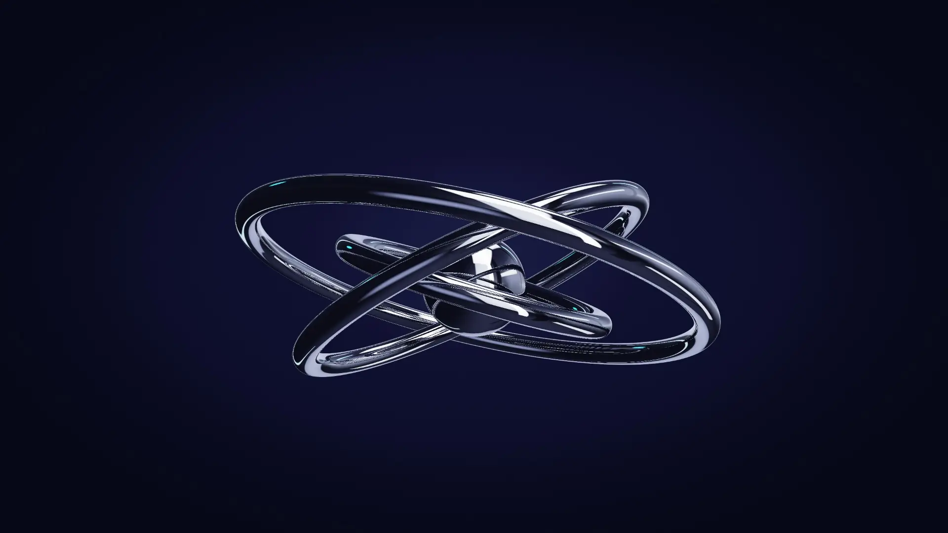 Three chrome rings aligning around a core — from a low angle